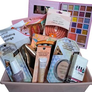 Medium pamper her gift basket featuring makeup brushes, lotion, and beauty products.