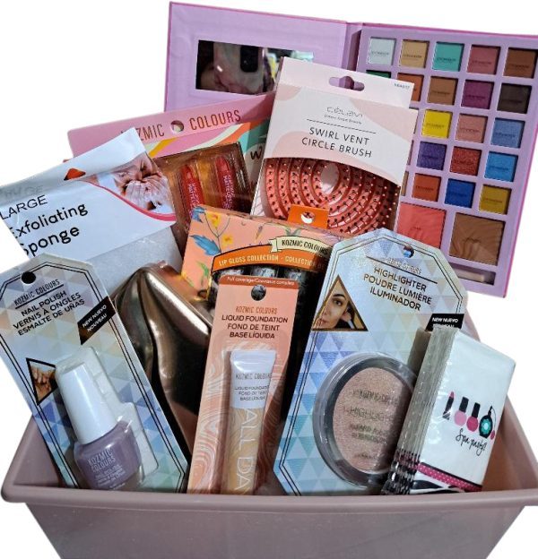 Medium pamper her gift basket featuring makeup brushes, lotion, and beauty products.