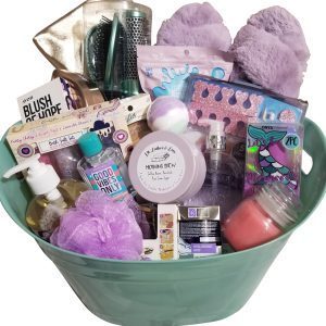 Luxury spa gift basket for women featuring blankets slippers and bath bombs