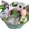 Curated gardening gift basket featuring tools, seeds, and birdhouse for gardeners.