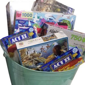A curated family puzzle night gift box with games and snacks for a family night in.