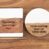 Bulk personalized wood and marble coasters with custom laser engraved company logo for corporate events.