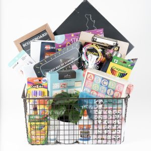 Large personalized teacher appreciation gift basket with classroom supplies in a wire crate.