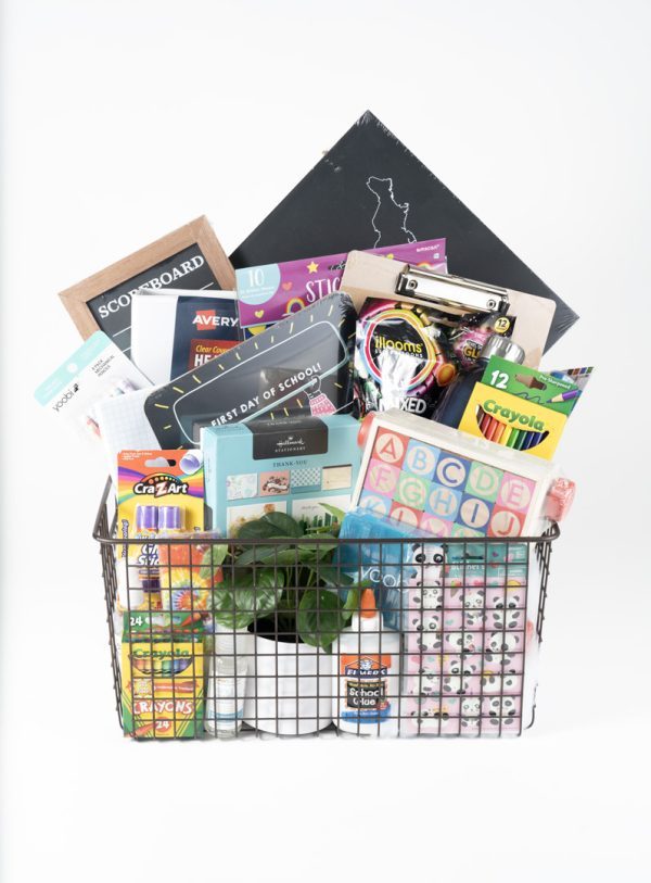Large personalized teacher appreciation gift basket with classroom supplies in a wire crate.