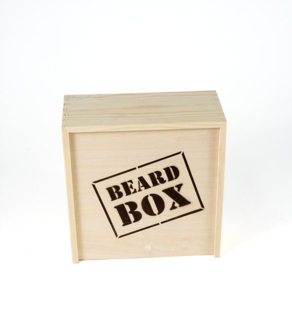 A square wooden box labeled "ADULT GAMBLING NIGHT BASKET" on the front side. The box has a natural wood finish and appears to be a storage or gift box, likely intended for grooming products or accessories related to beard care, perfect for any adult man's nightly routine.