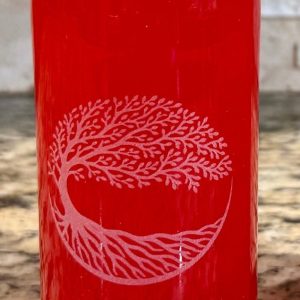 Custom etched glass bottles with laser engraved corporate logo used as a wedding centerpiece.