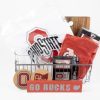 Ohio State Buckeye gift basket from Ohio Basket Chic featuring a custom-engraved wooden Buckeye themed cutting board and two laser-etched Ohio State pint glasses