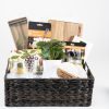 Personalized housewarming gift basket with custom engraved wood cutting board, two custom glasses, 2 engraved coasters, and premium throw blanket.