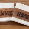 Pair of 4-inch square white marble and wood pet coasters with laser-engraved paw print Home design