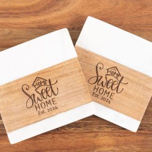 Pair of square marble and wood coasters engraved with Home Sweet Home for realtor closing gifts.