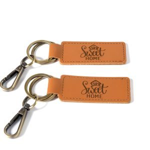 Set of 2 personalized housewarming gift key chains from Ohio Basket Chic, ideal as a realtor closing gift.