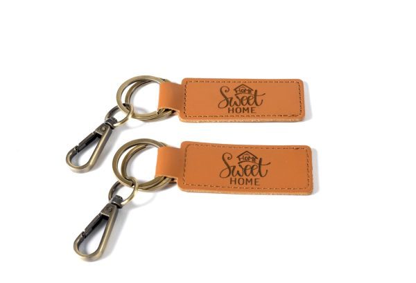 Set of 2 personalized housewarming gift key chains from Ohio Basket Chic, ideal as a realtor closing gift.
