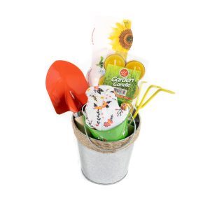 Personalized gardening gift basket with tools and treats for new homeowners.