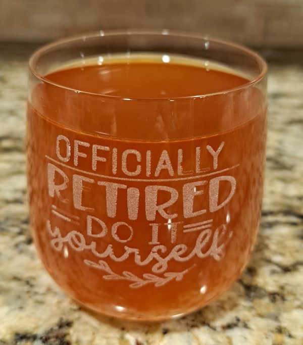 Etched rocks glass with "Officially Retired" design for retirement gift.