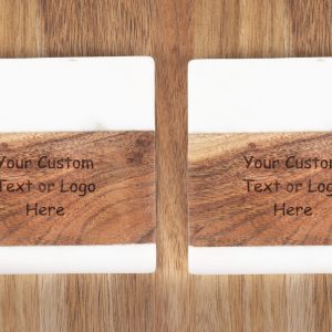 Pair of personalized marble and wood coasters with custom laser engraved logo