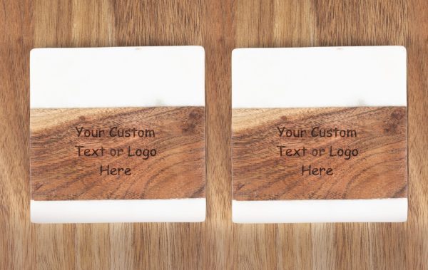 Pair of personalized marble and wood coasters with custom laser engraved logo