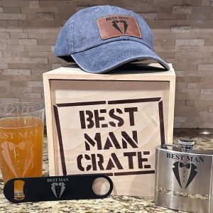 Best Man Gift Set inside a stenciled birch wood crate featuring a blue distressed hat flask pint glass and bottle opener.