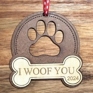 Personalized dog Christmas ornament handcrafted from natural birch wood with bone ribbon.