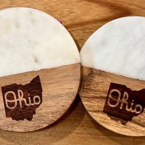 Pair of 4-inch round State of Ohio coasters made of white marble and natural wood.
