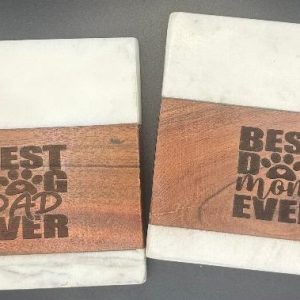 Pair of laser engraved marble and wood Dog Mom and Dog Dad coasters for pet parents.