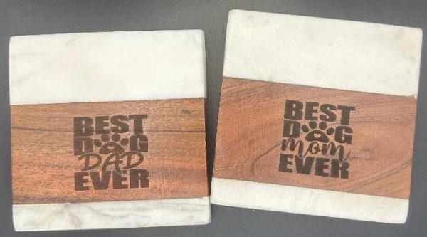 Pair of laser engraved marble and wood Dog Mom and Dog Dad coasters for pet parents.