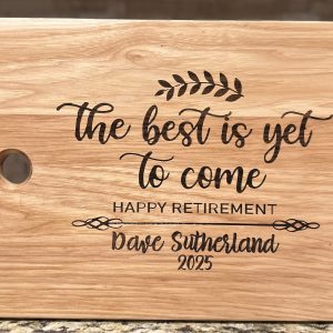 Personalized retirement cutting board made of solid hickory engraved with name and date