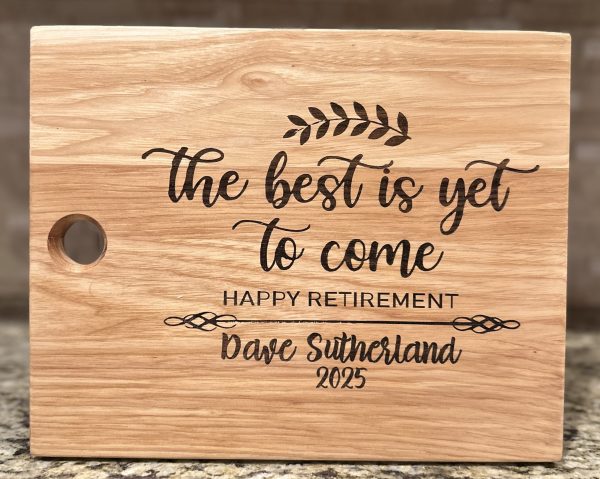 Personalized retirement cutting board made of solid hickory engraved with name and date
