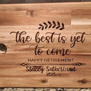 Personalized retirement cutting board made of acacia wood with custom name engraving