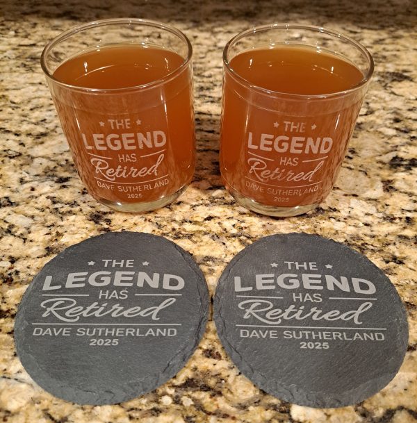 Personalized retirement whiskey gift set with two engraved glasses and slate coasters for bourbon lovers and whiskey lovers.