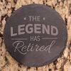 Natural slate retirement coasters engraved with The Legend Has Retired