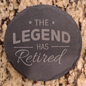 Natural slate retirement coasters engraved with The Legend Has Retired