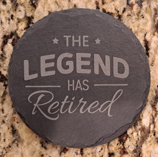 Natural slate retirement coasters engraved with The Legend Has Retired