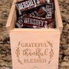Pack of 25 custom corporate logo gift boxes made of engraved wood for client appreciation and corporate event swag.