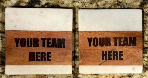 Personalized marble and wood coasters engraved with custom sports team logo.