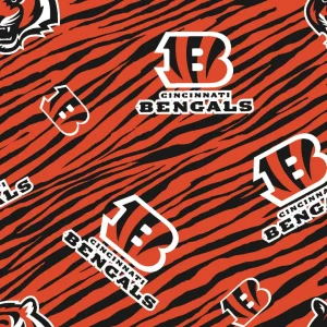 Personalized wooden Cincinnati Bengals ornament hanging on a tree as a custom football gift.