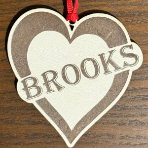 Personalized heart ornament engraved with name as a custom gift for a girlfriend or child