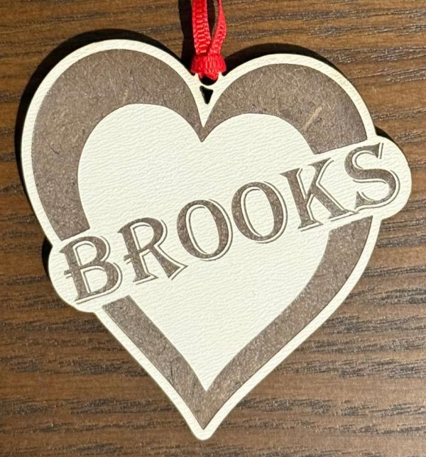 Personalized heart ornament engraved with name as a custom gift for a girlfriend or child