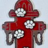 Personalized pet family ornament shaped like a wooden fire hydrant with custom engraved pet name paws.