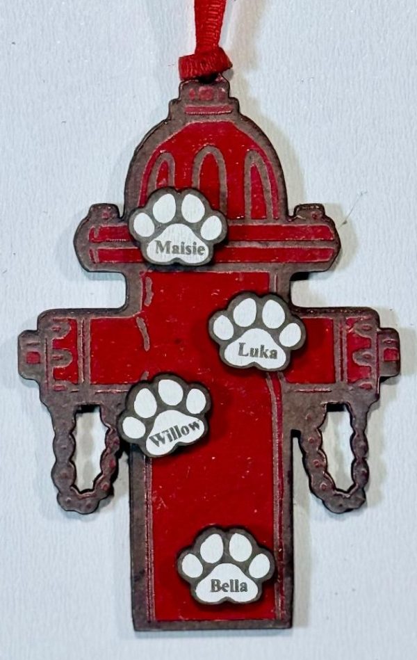 Personalized pet family ornament shaped like a wooden fire hydrant with custom engraved pet name paws.