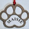 Personalized pet paw ornament custom engraved with pet name for Christmas tree decoration.
