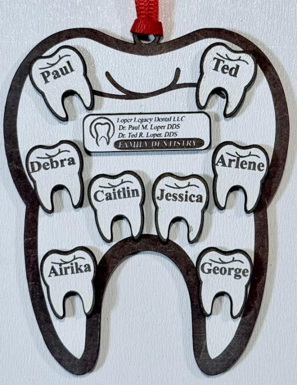 Personalized tooth ornament engraved with staff names as dental office staff gifts.