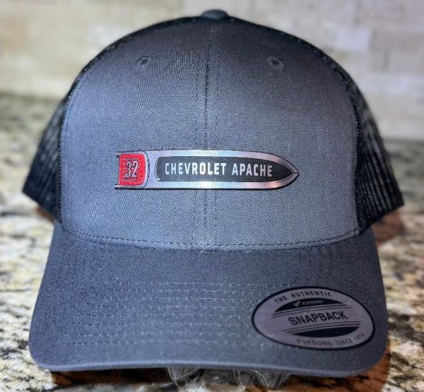Chevy Apache truck hat with 1958-1959 fender spear emblem on a classic gray or black trucker cap.